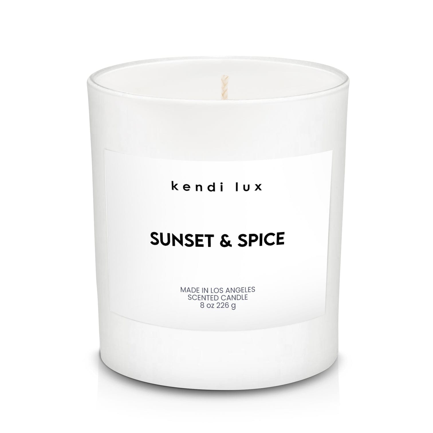Sunset &amp; Spice by Kendi Lux - Lookin’ for a scent that will leave you yearning for more?   Inspired by Mom’s freshly baked pumpkin pies, this scent will remind you of the irresistibly-sweet aromas that fill the entire house. Nothing is more special than a homemade apple pie, straight out of the oven!   This delicious fragrance begins with an apple and pear top note and a citrus undertone. The main theme blends cinnamon and nutmeg with a sugary sweetness. This gives the fragrance a fresh-out-of-the-oven warm tone. The fragrance dries down to vanilla and baked pie scent.   Fragrance Details   Top Note: Sliced Mac Apple, Anjou Pear, Mandarin Mid Note: Cinnamon Sticks, Brown Sugar, Nutmeg Base Note: Baked Pie, Vanilla, White Cocoa     Product Details  Soy blend candle with braided cotton wick in a white glass tumbler. 9.0 ounces (240g). 3.4 inches (8.6cm) tall. Approximately 50 hour burn time.