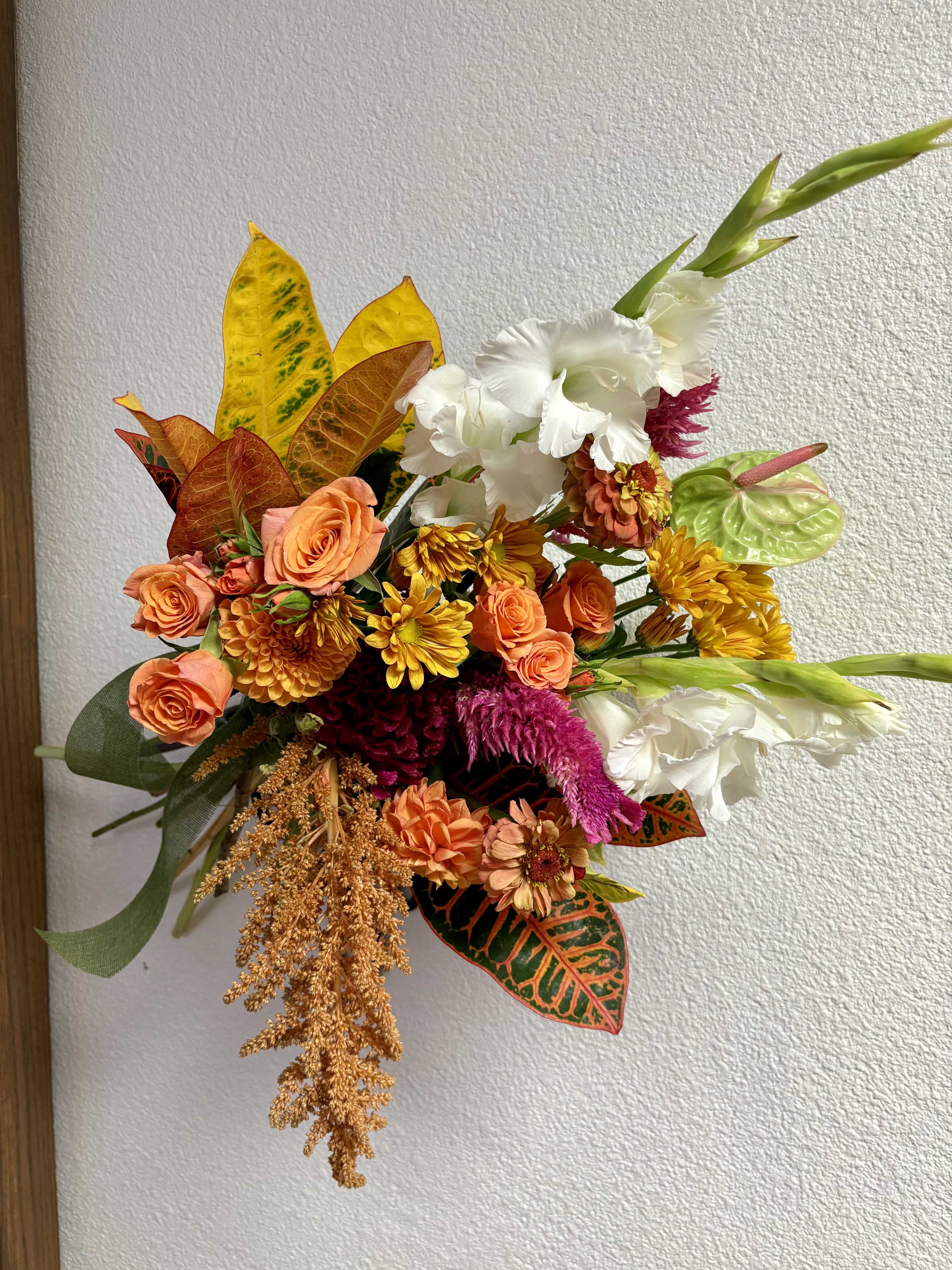 FRESH DROP NO 3 - This drop includes Seasonal Dahlias, Anthurium, Gladiolas, Zinnias, Amaranthus, Spray Roses, Celosia, Diasies, and seasonal leaves.  Purchase Standard for hand-held bouquet with paper and ribbon. Purchase Deluxe or Premium for arrangement designed in a vase.  LIMITED AVAILABILITY
