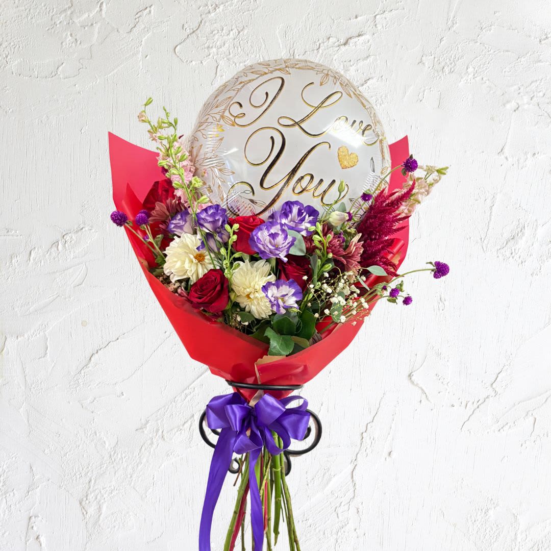 I Love You Blooms with Mylar - I Love You Blooms with Mylar with seasonal flowers and lisianthus Purchase standard for hand-held bouquet wrap and deluxe for bouquet designed in a vase.