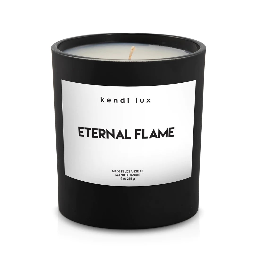 Eternal Flame x Kendi Lux - Fragrance Details:   Fresh, green aldehydic notes and island gardenia sit atop a floral heart of rose, jasmine and muguet, with soft bottom notes of creamy petals.  Top: Gardenia Bouquet, Citron, Verbena  Middle: Jasmine, Rosewater, Coconut  Bottom: Tiare Bloom, Musk, Vanilla, Orchid  Product Details:  Soy blend candle with braided cotton wick in a black glass tumbler. 8.0 ounces (226g). 3.4 inches (8.6cm) tall. Approximately 50 hour burn time.