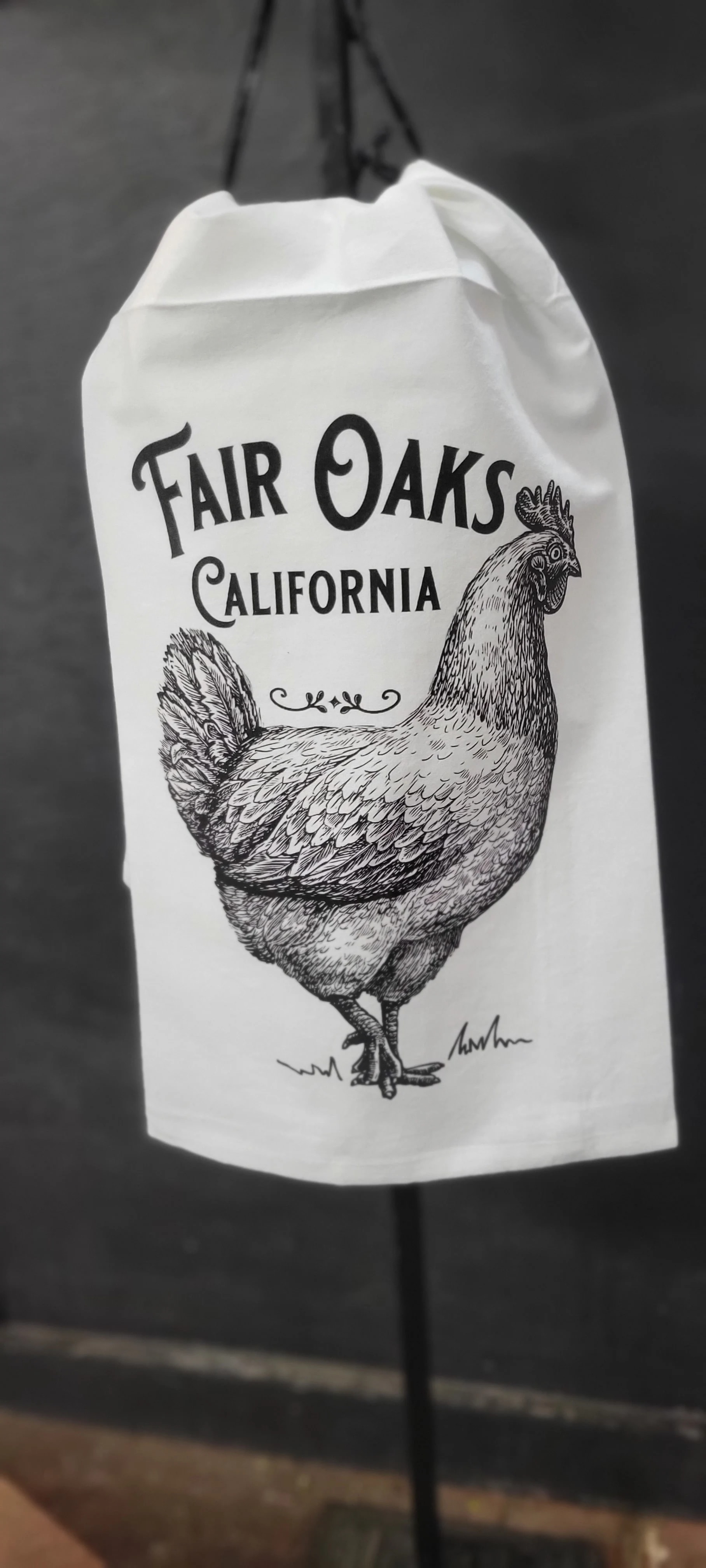 White tote bag with a black chicken illustration and Fair Oaks California text