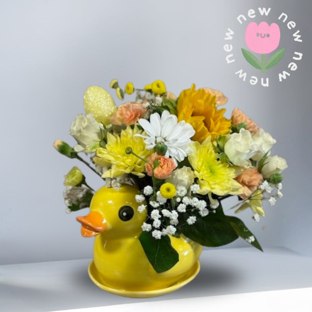 Duckling Delight - A sweet celebration of spring, our Duckling Delight Arrangement features fresh seasonal blooms designed in a keepsake duck vase. Filled with soft pastels and cheerful colors, it’s perfect for Easter gifting, kids birthdays babies showers or new baby.