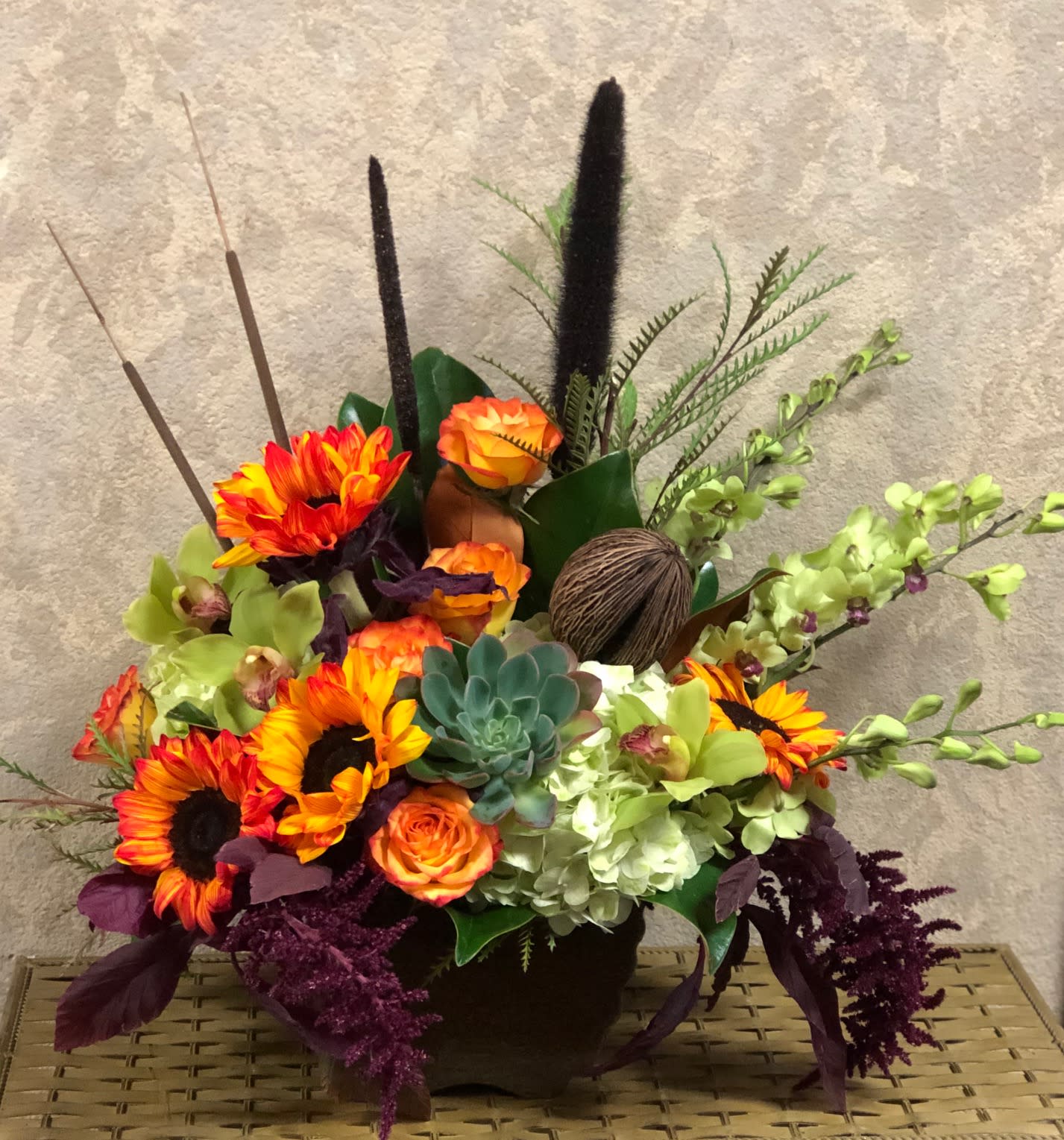 Welcome Autumn - Type of Flowers: Green hydrangeas, sunflowers, roses, sembyrium Orquide, dendrobium orchid greens, magnolia leaves, amaranthus on a ceramic brown vase.