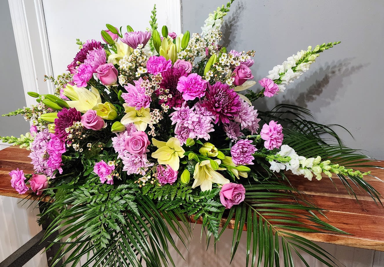 Large pink and white floral spray with lilies and roses