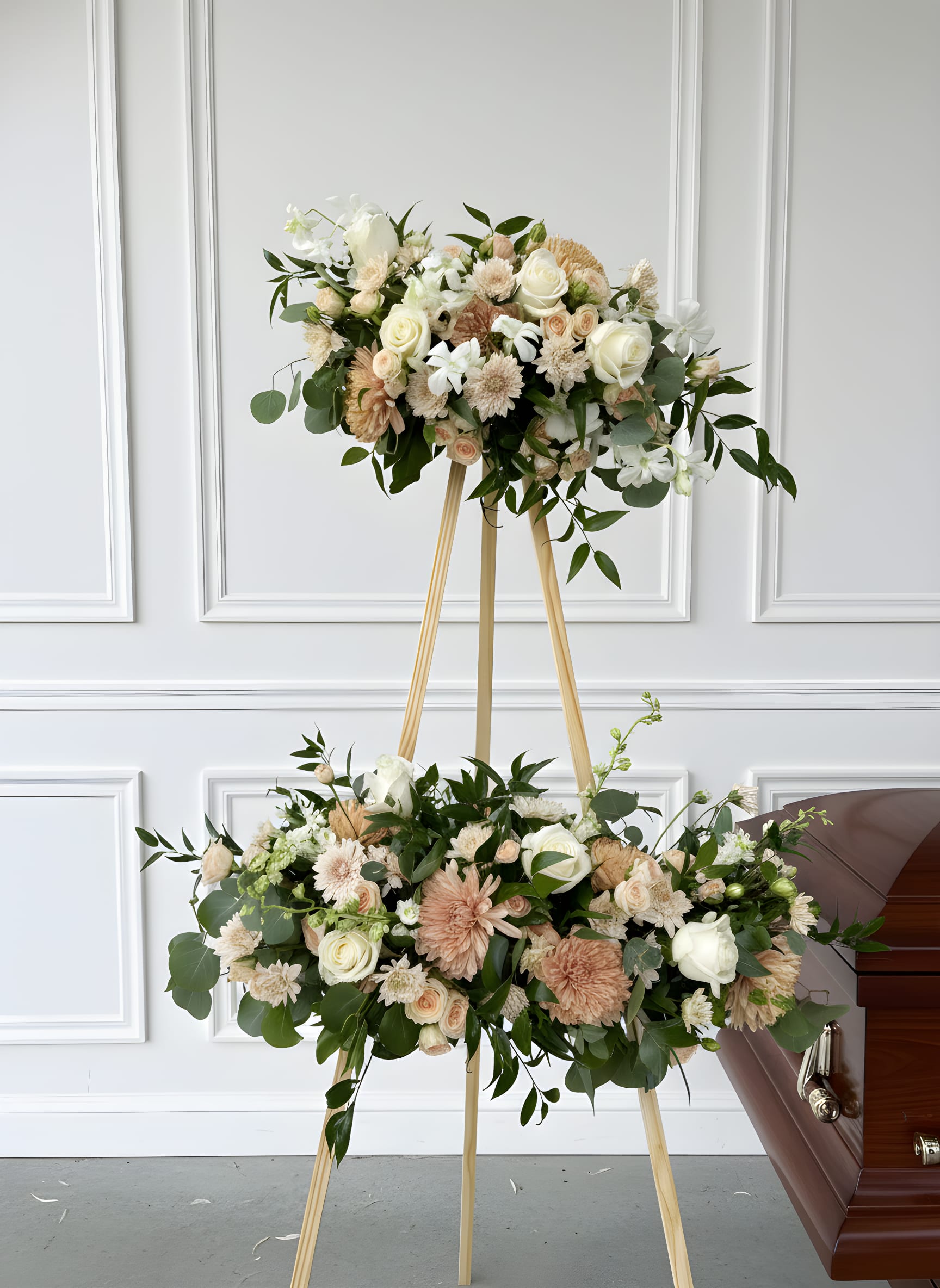LF420 Picture Spray  - Honor the memory of a loved one with this elegant Picture Frame Spray, thoughtfully designed to showcase  a cherished photograph during the funeral or memorial service.  Pictured here is a soft blend of creams, ivory, blushes and natural greenery, however, we can customize many different color palettes depending on seasonal availability and personal preference. 