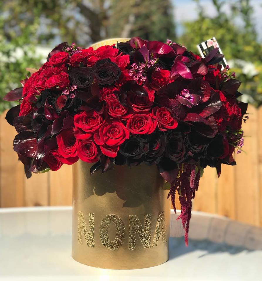 Midnight romance gold box with mixed black and red roses - Simply speaking, red means romance. Send this bouquet of vibrant red roses to your sweetheart and you'll convey passion, energy and desire.  