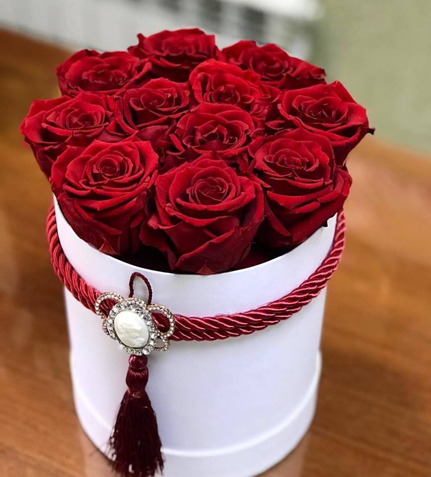 Simple, small, elegant  red rose box - This is our smallest box available. Sometimes less is more.This small box filled with roses will put a smile on anyone's face on any occasion or just a reminder that some loves them.    You can change the color of the box and roses in the special instructions section.