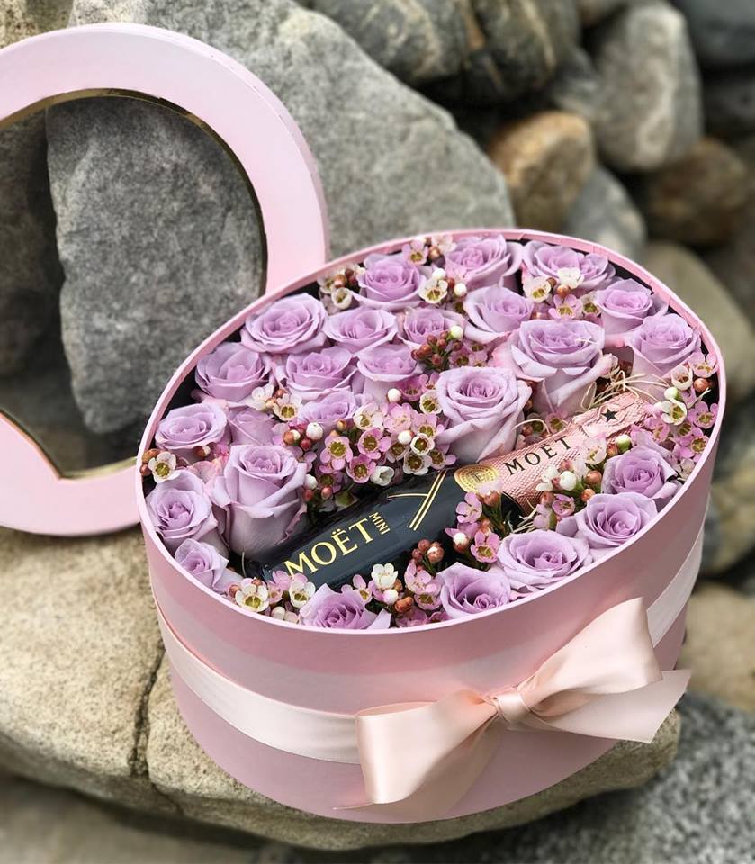 Pink hatbox with lavender roses and a Moët bottle