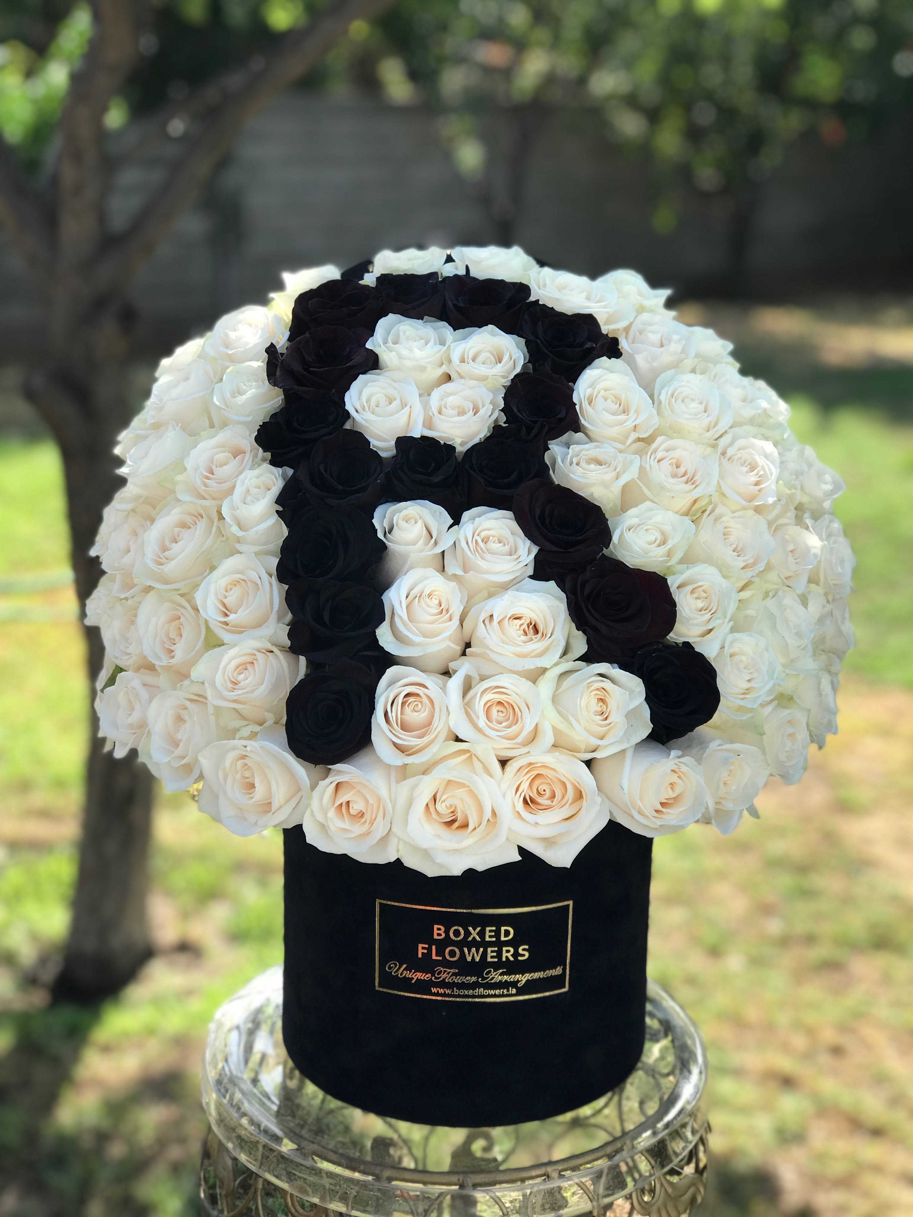 Signature velvet initial box - This is an elegant and thoughtful gift for that special someone. Filed with over 100 roses.Comes in our signature black velvet box. You can customize the color of the roses and the initial at the special instructions section at checkout.