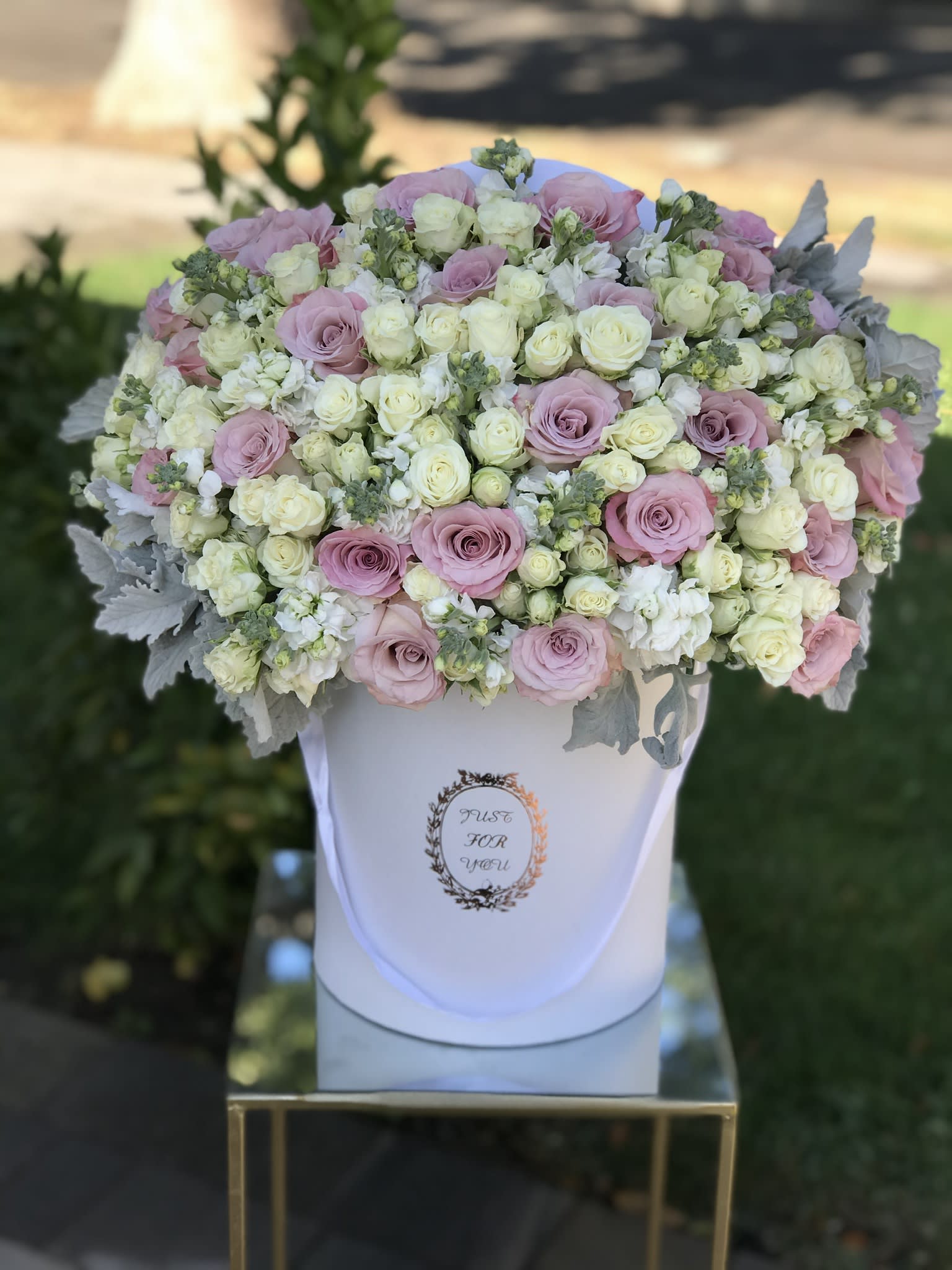 Hope and Faith box  - This is a stunning white box filled with Faith roses and white spray rosses in addition to white stock and dusty Miller for that velvety touch. Great for any occasion.