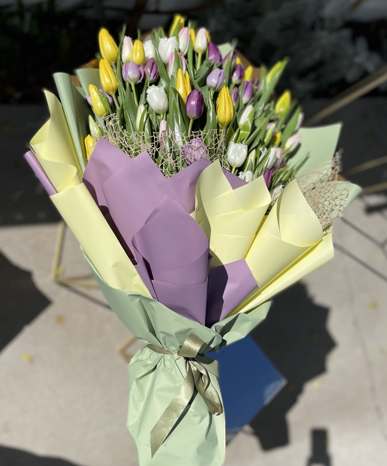 50 mixed tulip bouquet - Mixed tulip bouquet wrapped in colorful paper. 