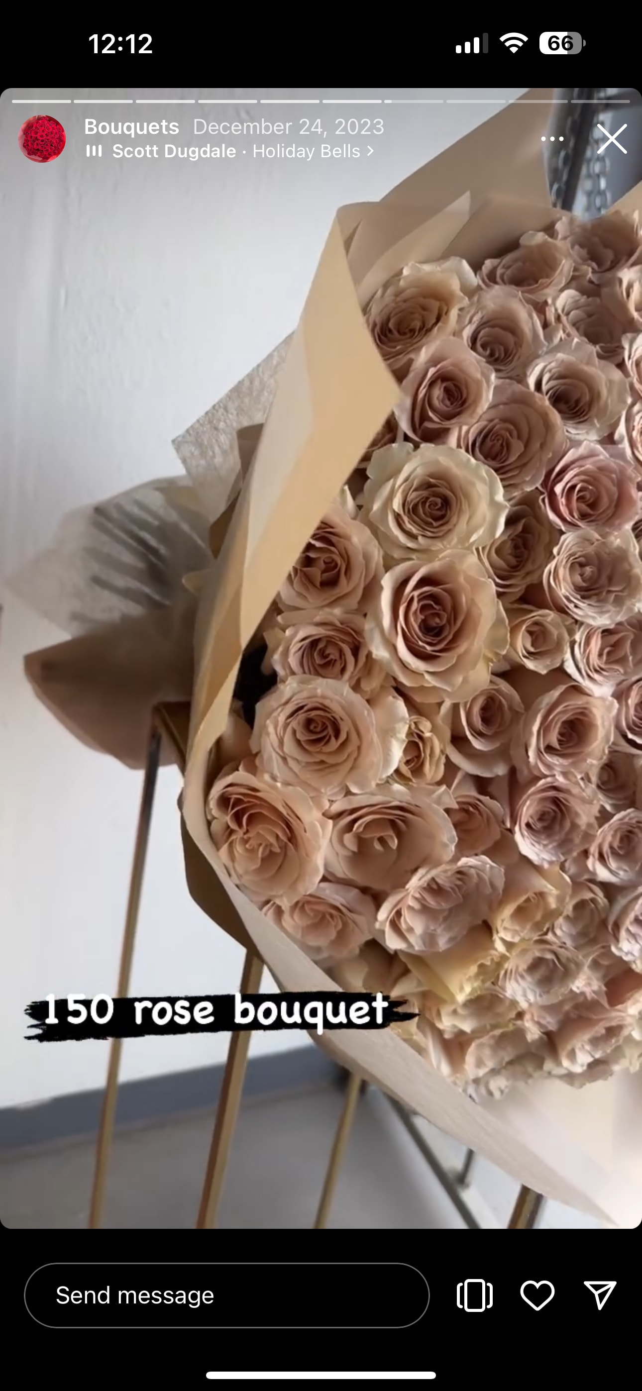 Large bouquet of blush roses wrapped in tan paper