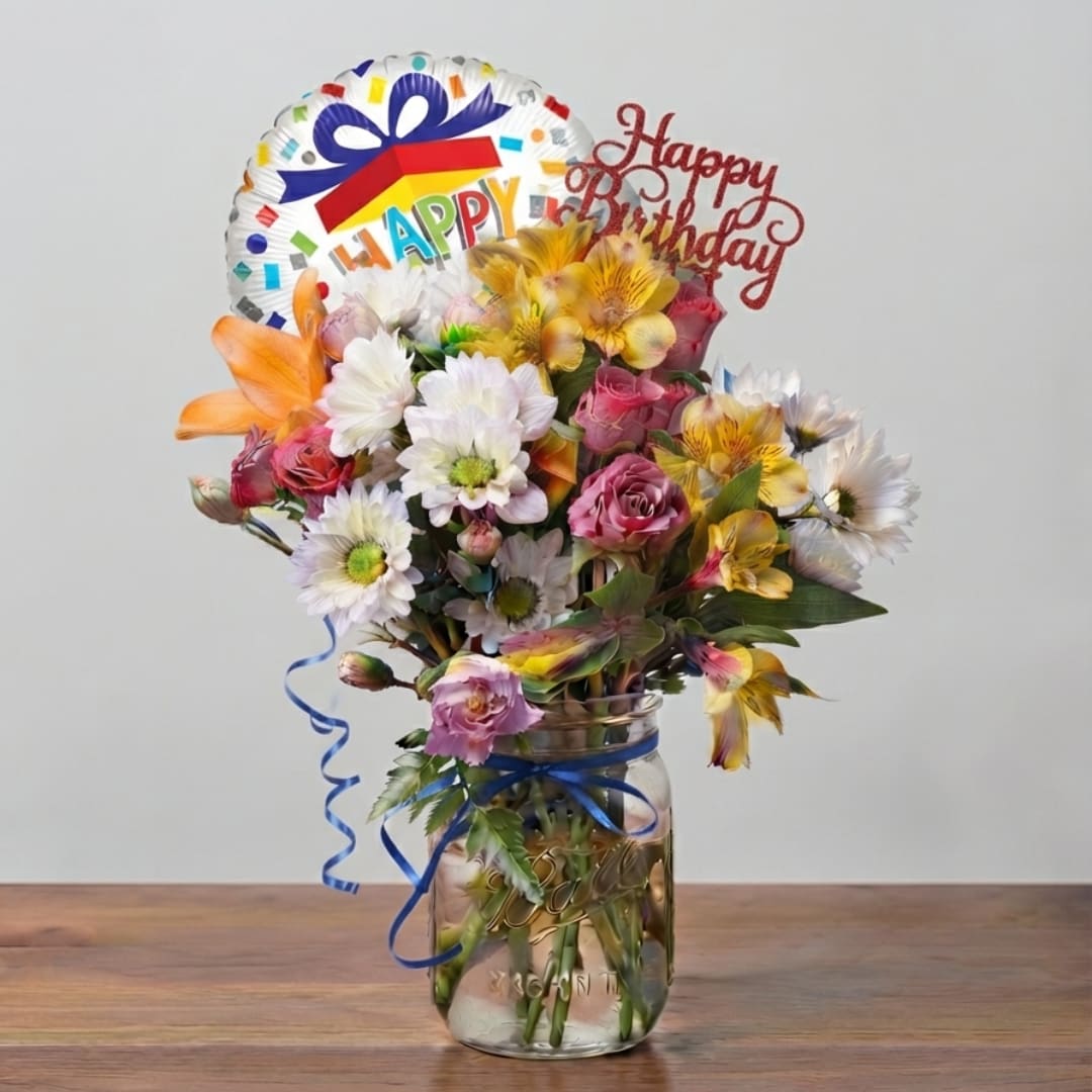 Birthday bouquet in a glass jar with a foil balloon and glitter topper