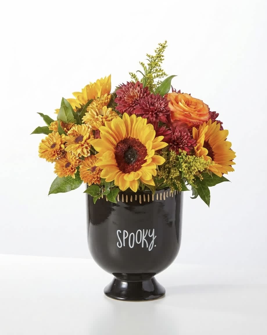 Fall flower arrangement in a black vase with "spooky" text