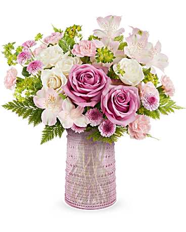 Pink and white bouquet in a textured pink vase