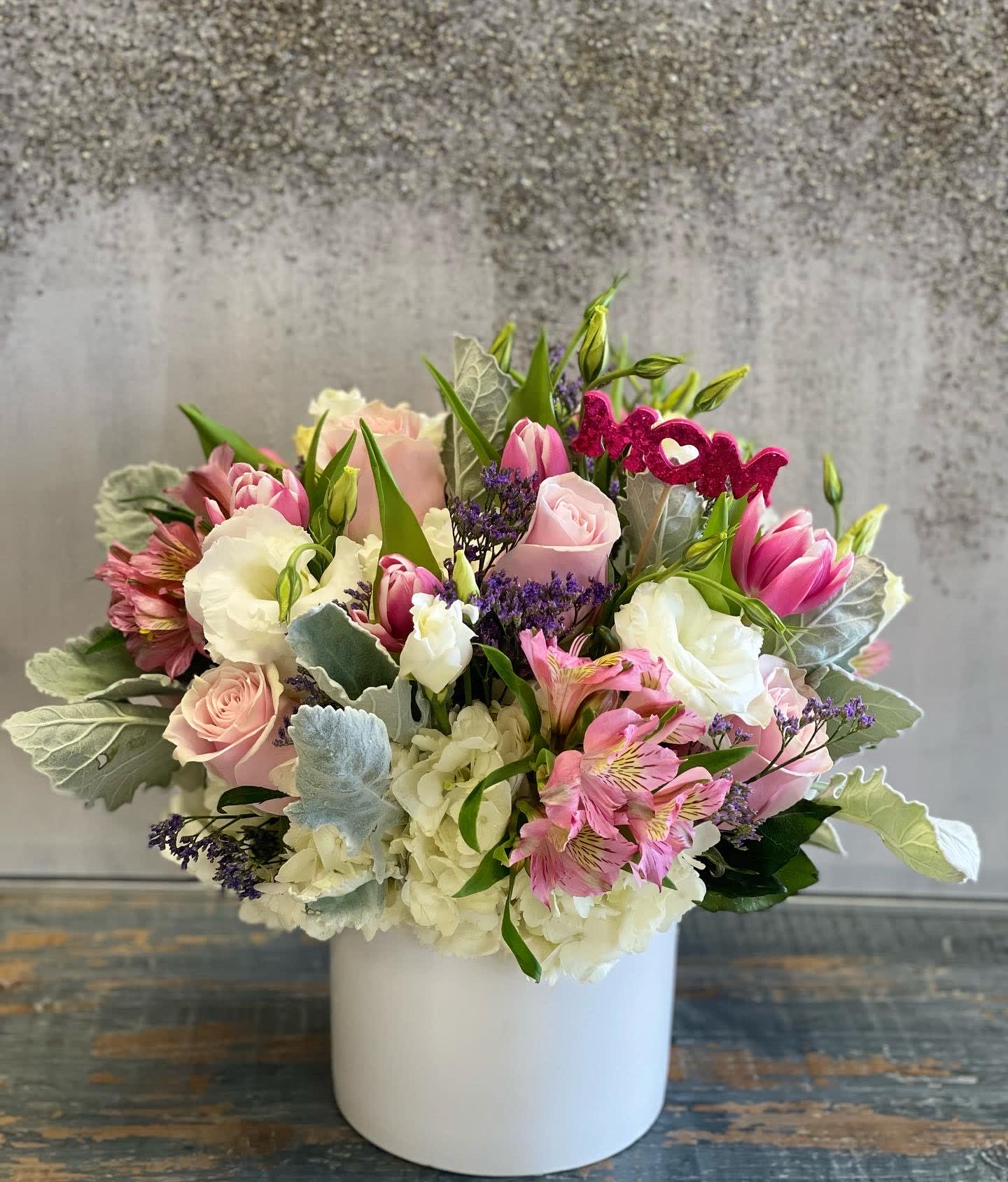 Sweet Cream with Tulips - This angelic arrangement is as cute as it is pretty. Featuring the soft texture of lambs ear and pastel colors, Sweet Cream is a warm hug and smile. Perfect for welcoming a new baby, a birthday or making somebody's day a little sweeter.