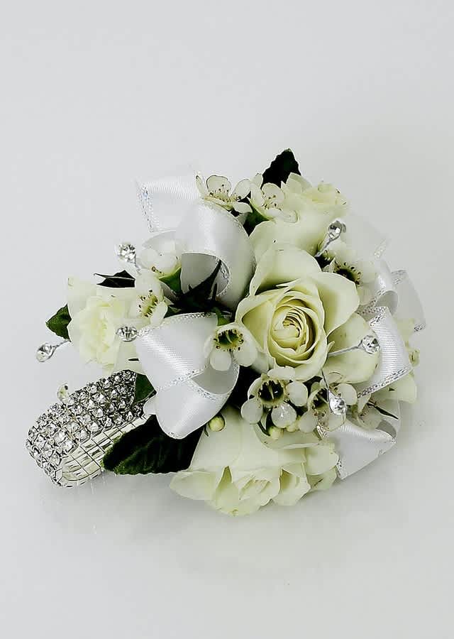 White rose corsage with ribbon and rhinestone accents
