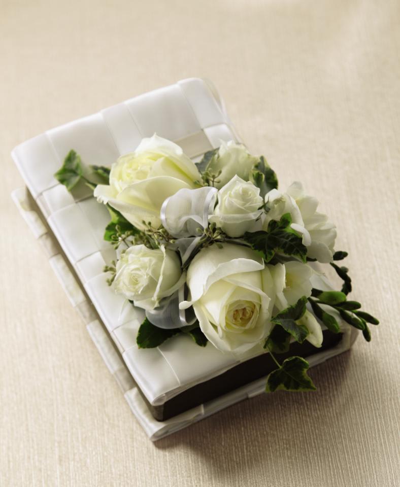 FTD Rose Charm Bouquet - The FTDÂ® Rose Charmâ¢ Bouquet is the perfect bridal gift on the wedding  day. An incredible bouquet of white roses, freesia, spray roses and lush  greens are elegantly arranged on top of a bible accented with a basket  weave pattern of white satin ribbon. A gift they will always hold dear.  Approx. 11âH x 6âW. 