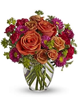Bouquet of orange roses and purple daisies in a clear glass vase