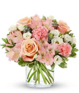 Pink and peach bouquet in a clear glass vase