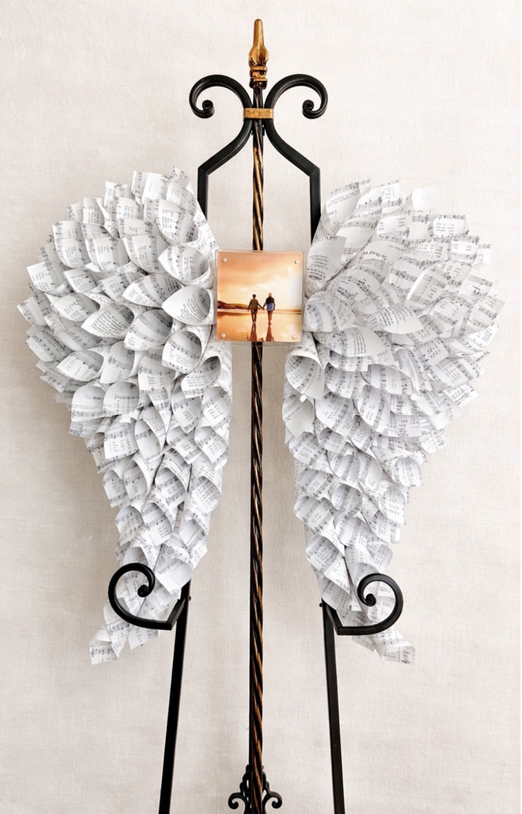 Angel Wings 24"x24" with Custom Photo Center - 24“ x 24“ angel wings made from hymnal pages with frame for a custom photo.  These angel wings are the perfect memorial gift, a true keepsake they will treasure forever.