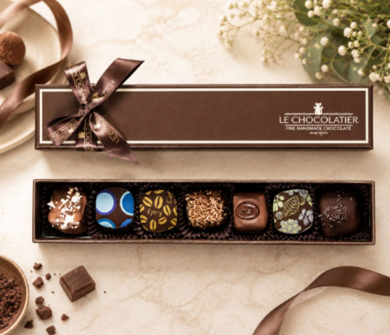 Box of assorted chocolates with a ribbon bow