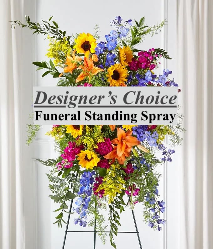 Sympathy Standing Spray Designer's Choice - Honor a beautiful life with warmth and vibrant color through our Sympathy Funeral Standing Spray - Designer's Choice, a one-of-a-kind, custom-created design. Perfect for memorial services, celebration of life events, or family-led tributes where a unique, uplifting expression is requested, this tall, cascading arrangement is handcrafted using the absolute freshest seasonal flowers available. Our experienced floral designers masterfully layer premium blooms and greenery, creating a vertical masterpiece that will be displayed on an easel.   We provide specialized hand delivery directly to viewings, houses of worship, and funeral homes throughout Cambridge, Somerville, Medford, Arlington, Watertown, Belmont, Winchester, Boston, Charlestown, Brookline, Brighton, and Allston.   Please provide the Service Time and Location details upon ordering to ensure seamless coordination.  Order this unique, one-of-a-kind, custom-crafted tribute today to celebrate a cherished life with beauty and distinction.