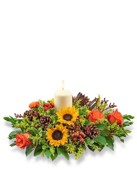 Candle centerpiece with sunflowers and orange roses