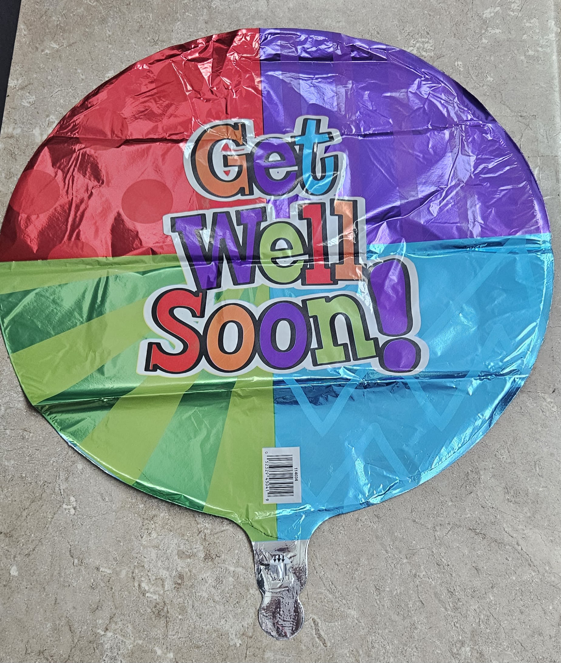 Round multicolor balloon with the words "Get Well Soon!"