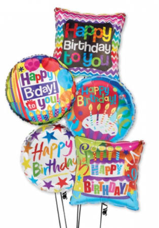 Cluster of colorful birthday balloons with printed messages