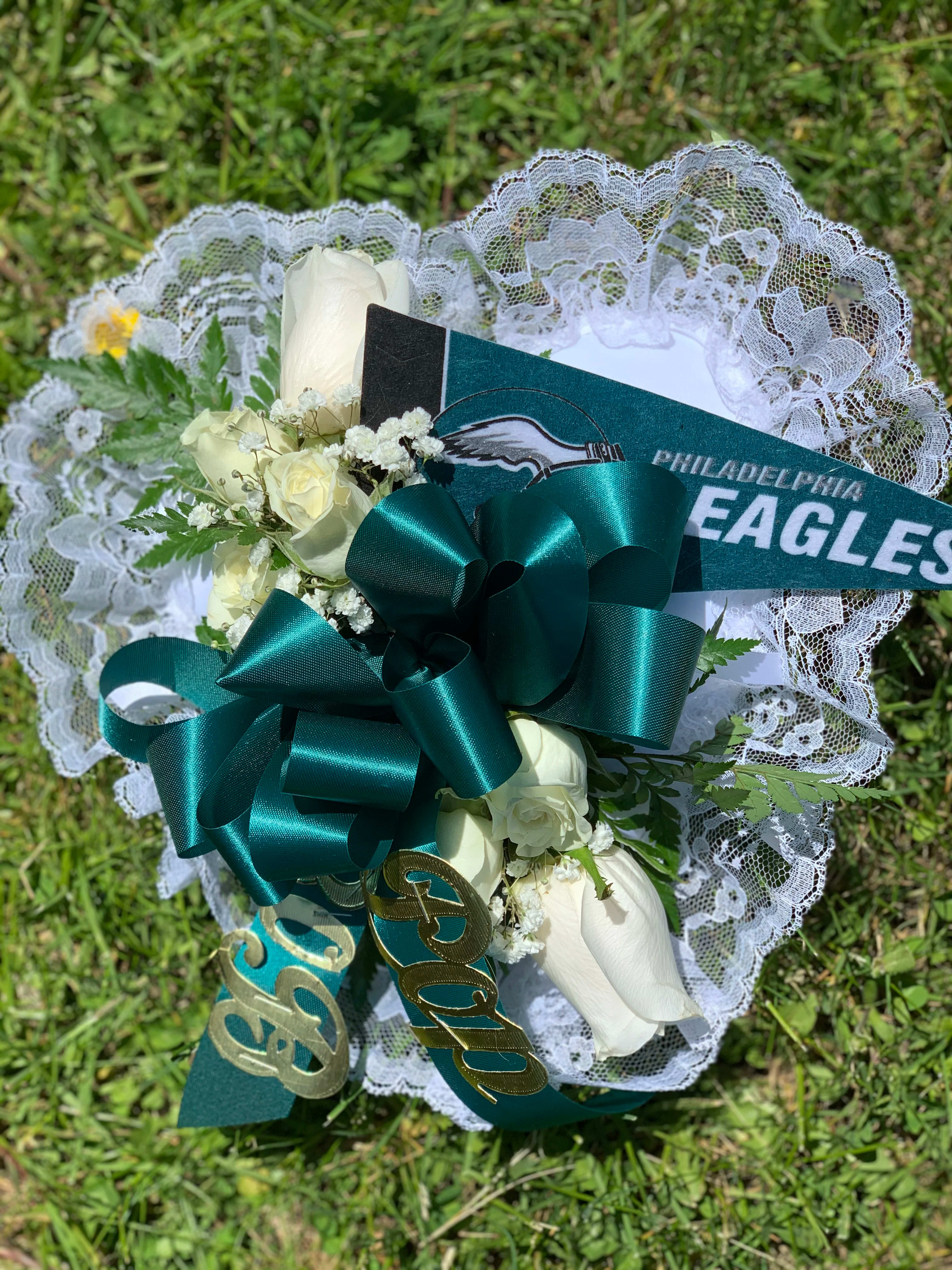 White rose bouquet with teal ribbon and lace trim