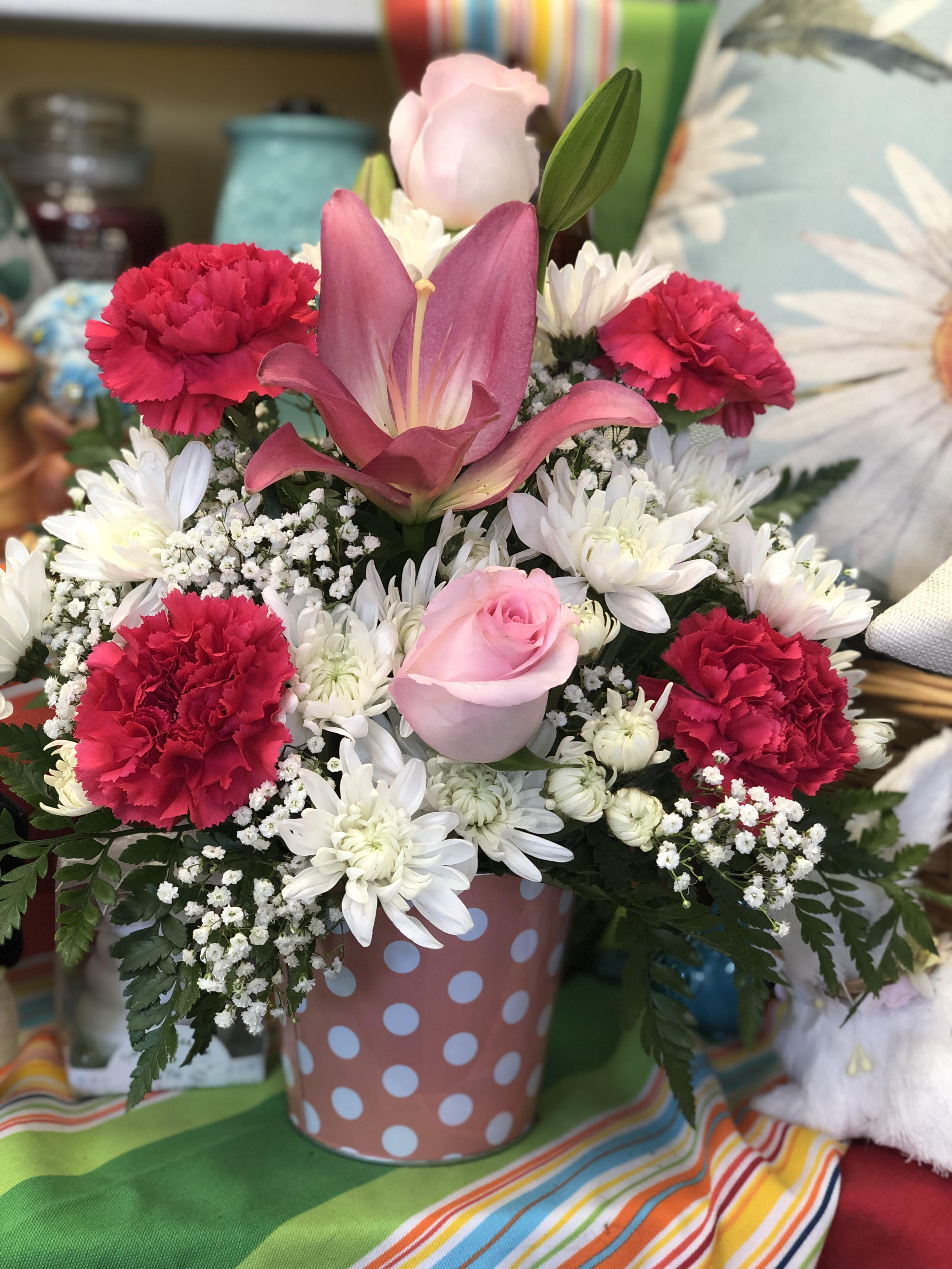 Pink and white mixed bouquet in a polka-dot container