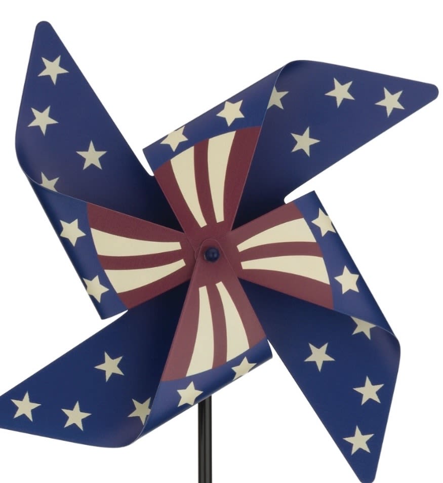 Celebrate America Spinner - Let freedom spin with the Americana Spinner Stake – Flag. This large, durable pinwheel features strong, flag-painted blades designed with ball bearings to catch even the slightest breeze.   A striking way to add motion, color, and patriotic pride to your yard or garden. Catch the breeze, wave the flag