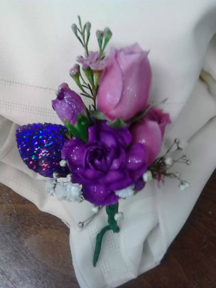Small bouquet of pink and purple roses with glitter accents