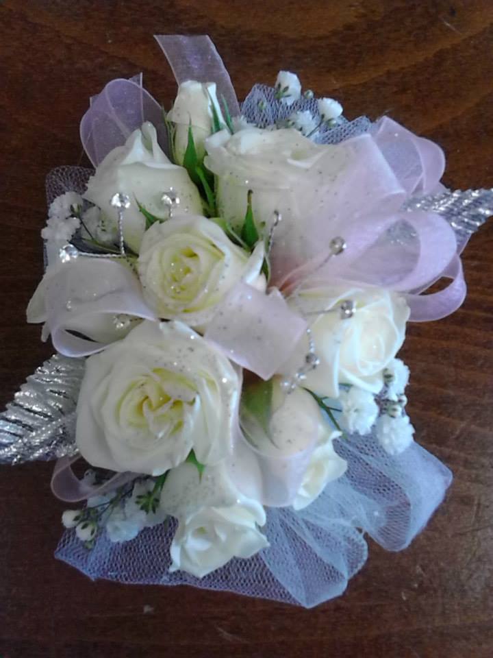 White rose bouquet with lavender ribbon and silver accents