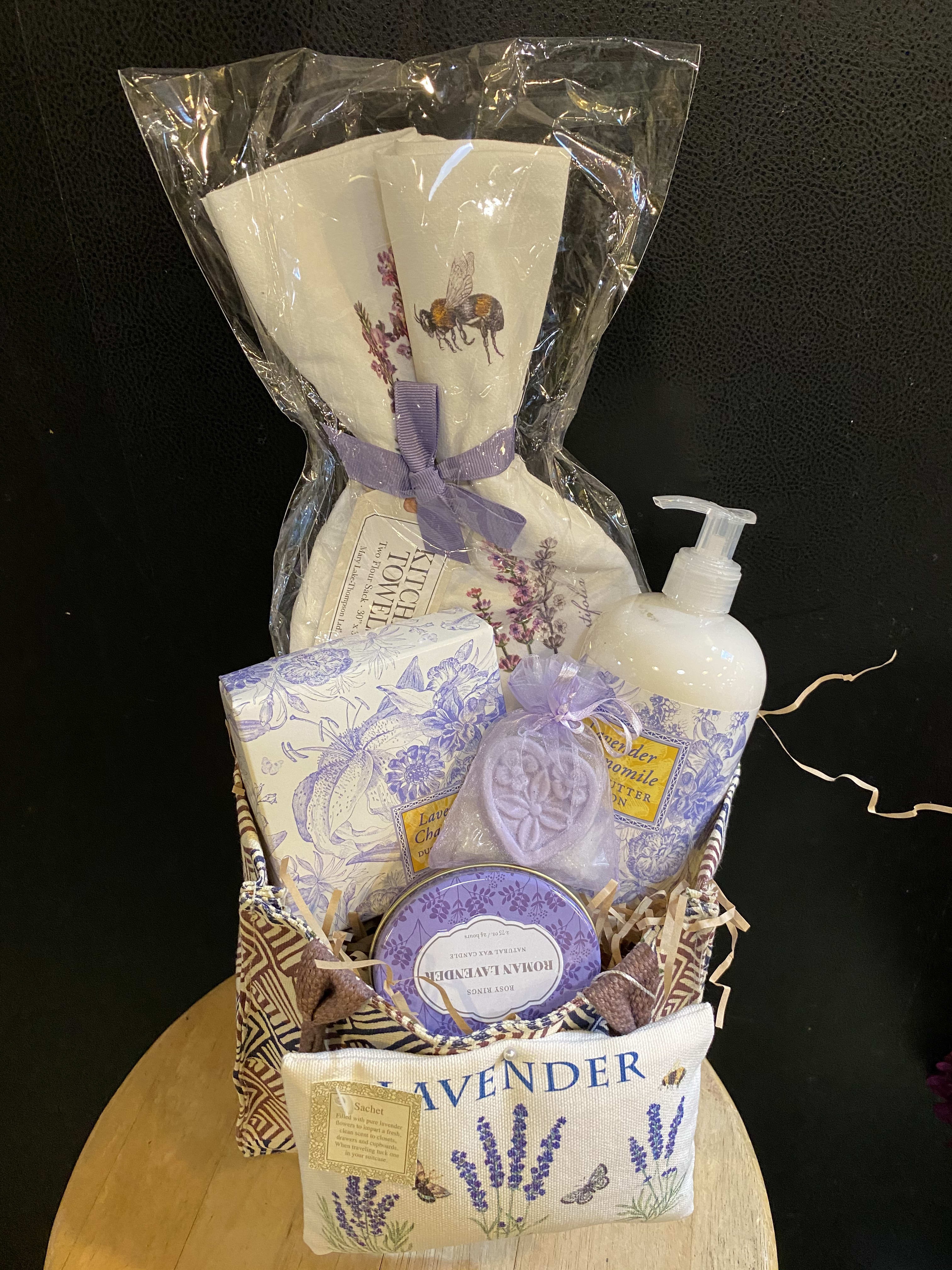 Lavender-themed gift basket with soaps, lotion, and sachets