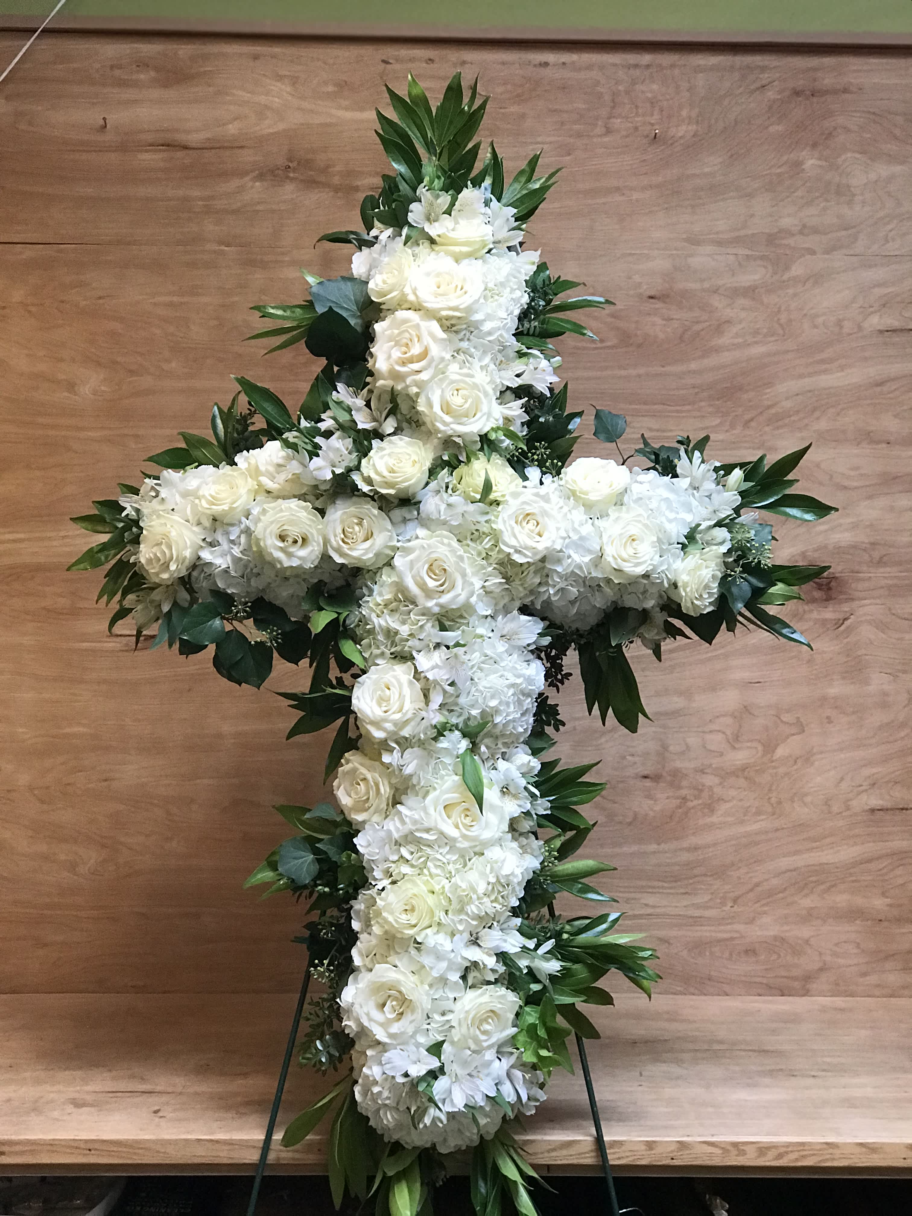 White and Green Cross - An elegant display of faith and divine peace, this beautiful arrangement will comfort the bereaved in a truly thoughtful and respectful way.