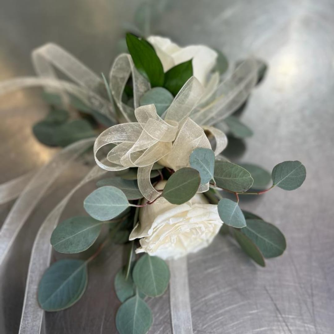 White rose boutonniere with eucalyptus and sheer ribbon