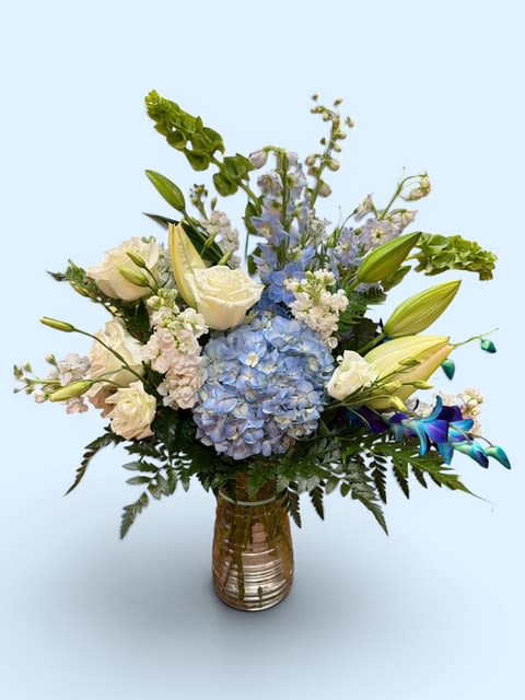 Blue Skies - This arrangement for mom will make her heart full and remind her you are her favorite child!