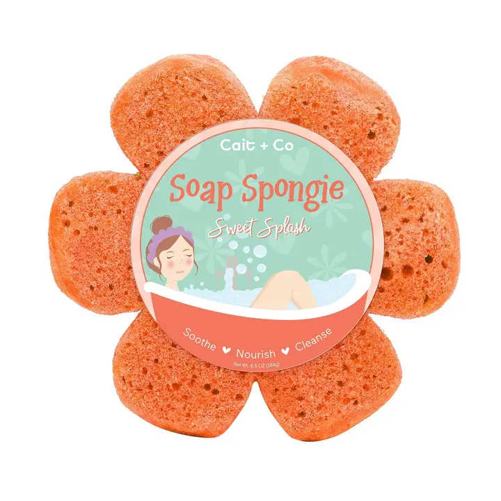Flower-shaped orange soap sponge with a round label