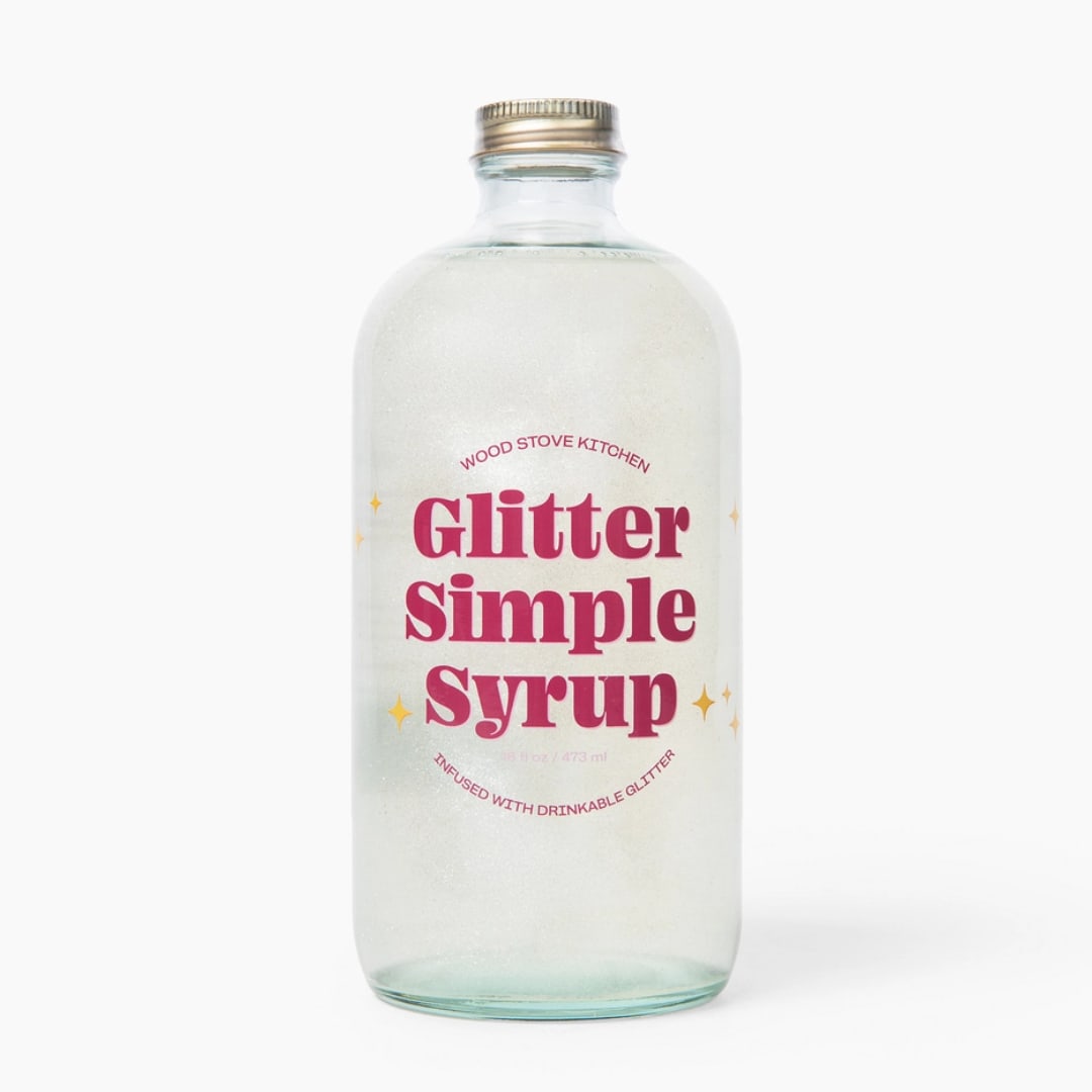 Bottle of glitter simple syrup with pink label