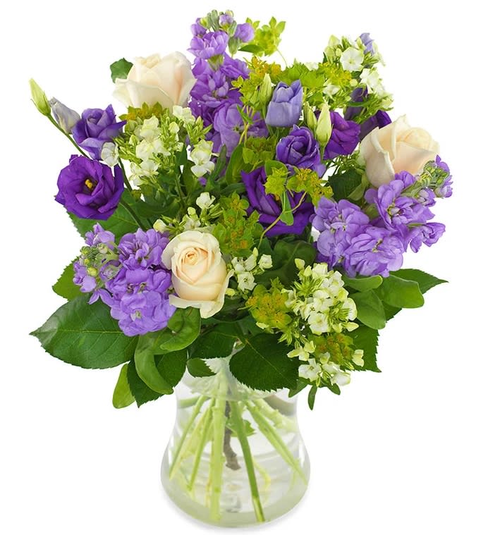 Morning Dew  bouquet  - Fresh and cool, yet exciting and hopeful. A fresh bouquet with roses, lisianthus, bupleurum and matthiola in purple and white that leaves a lasting impression.