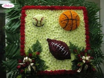 Floral sports-themed arrangement with basketball and football designs