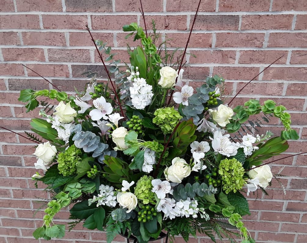 Large white and green floral spray with roses and hydrangeas