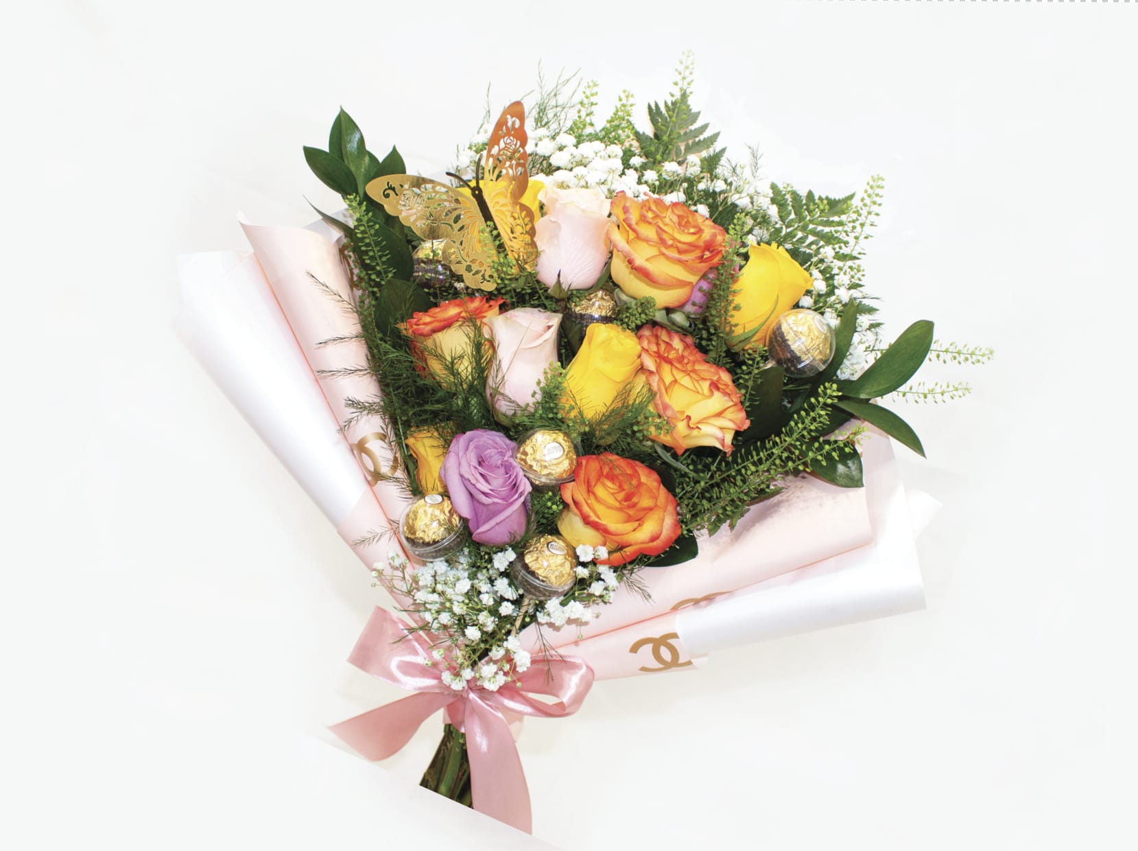 Bouquet of multicolored roses with a pink ribbon and gold butterfly decoration