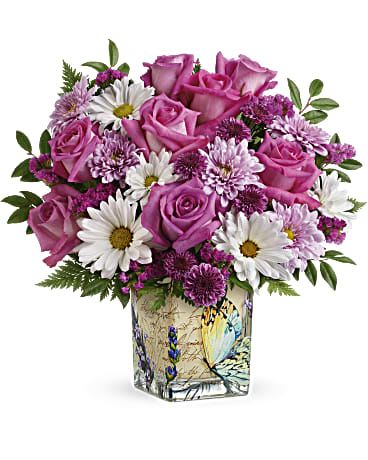 The Butterfly - Like a butterfly flittering around a secret garden, this delightful bouquet of pink roses in a vintage-inspired glass cube is a magical gift on Mother's Day or any special occasion.