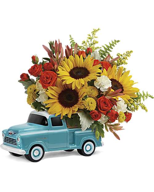 The Chevy Truck - Beep beep! They're sure to love this colorful bouquet of spray roses and sunflowers riding in the back of a classic Chevy pickup. This hand-painted, hand-glazed ceramic design is a cool keepsake they'll treasure forever! 