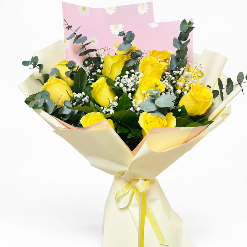 Bouquet of yellow roses with baby's breath and eucalyptus in pastel wrap
