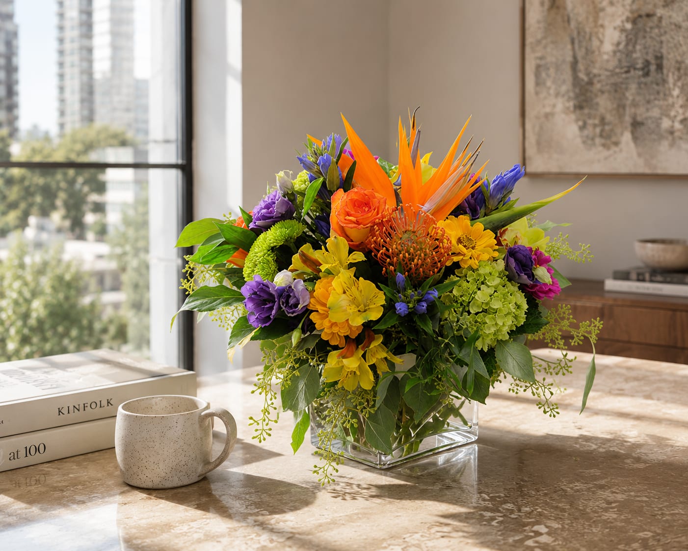 K119 Bold Mix Cube - Brighten any day with this lively mix of tropical and garden flowers, beautifully arranged in a clear glass cube! This colorful arrangement features elegant lisianthus, lush green hydrangea, striking Bird of Paradise, distinctive Pincushion Protea, and other tropical accents chosen for their wonderful color, texture, and lasting beauty.  Fun, cheerful, and delightfully different, this bouquet brings a happy touch of the tropics into any home or office. It is a terrific choice for birthdays, celebrations, thank-you gifts, get-well wishes, or simply sending someone a little sunshine.  Flowers and colors may vary slightly as we select the freshest blooms available. Handcrafted with care by Kiko’s Flower Shop, your local Park Ridge florist, with daily flower delivery throughout Park Ridge, Chicago, and much of the surrounding Metro Area.