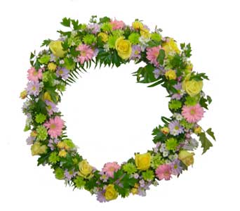 Circular floral wreath with pink, yellow, and lavender flowers
